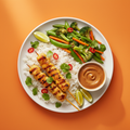 Chicken satay skewers with jasmine rice, stir-fried vegetables and peanut sauce on a warm orange background